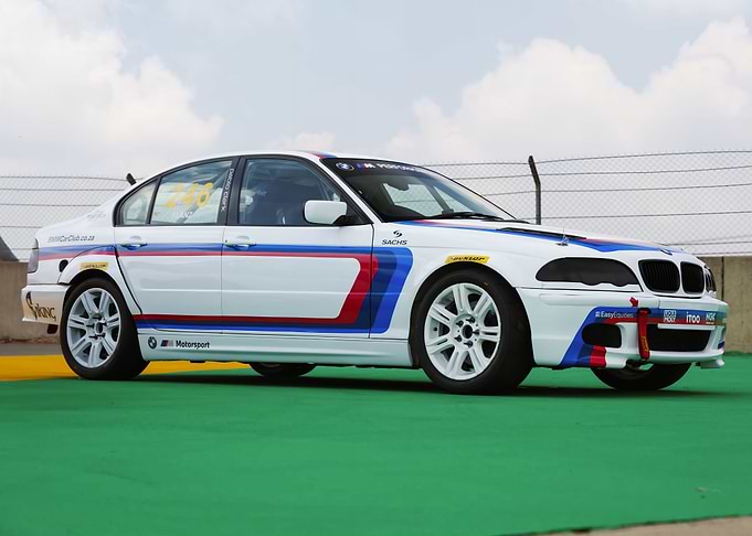 White BMW Race Car on Track