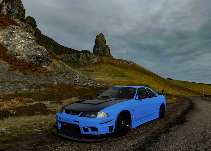 Blue Nissan Skyline on Mountain Road