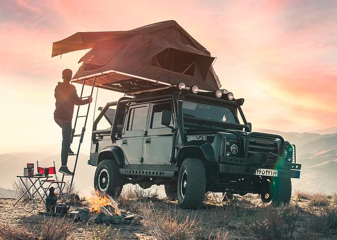 Off-Road Vehicle with Rooftop Tent Camping