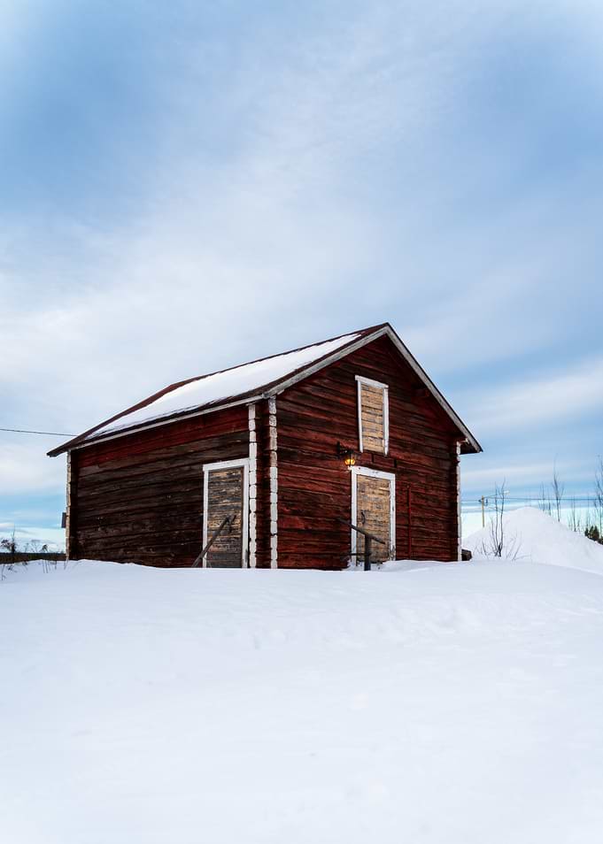 Red Barn in Winter Landscape