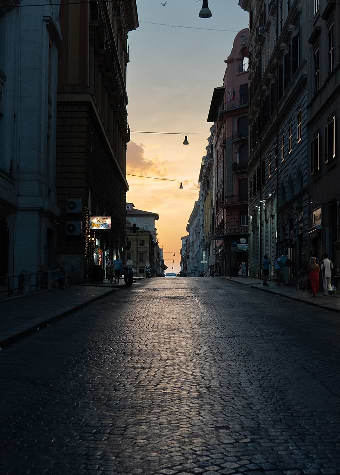 Cobblestone street at sunset in Rome