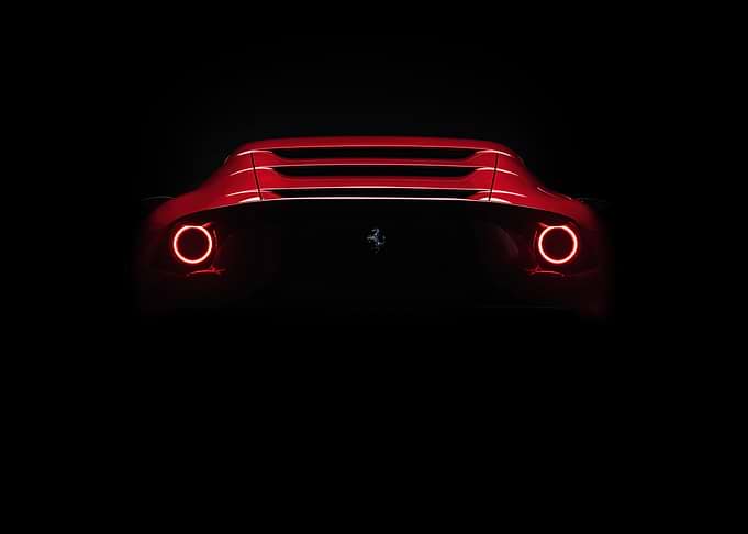 Red Ferrari Rear View in Darkness