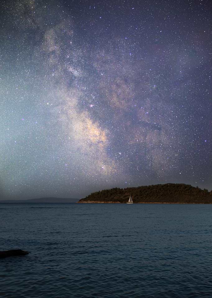 Milky Way over Ocean with Sailboat
