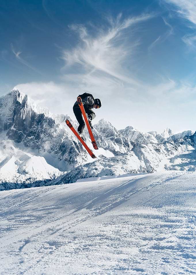 Skier mid-air snow skiing
