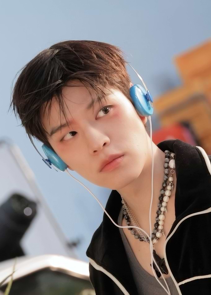 Portrait of a young man with headphones stay kids
