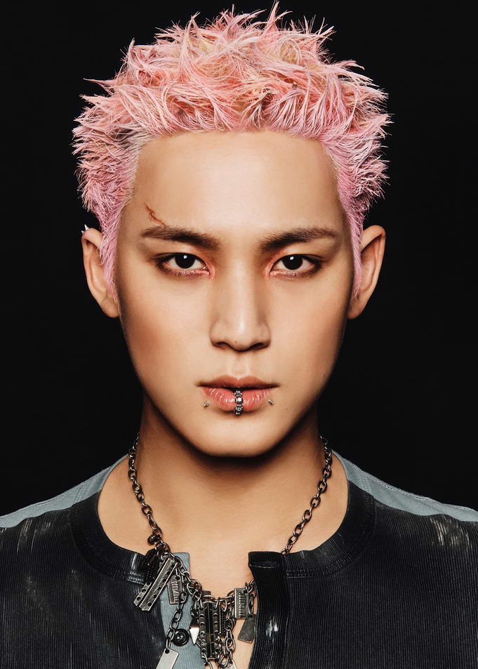 Portrait of a man with pink hair