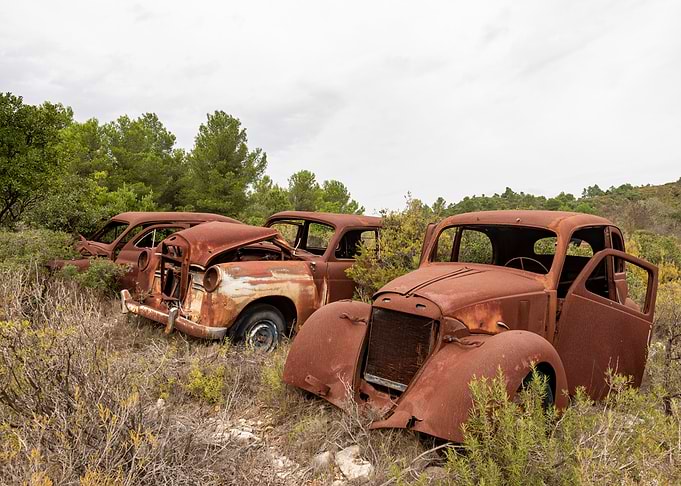 Abandoned Rusty Vintage Cars in Nature