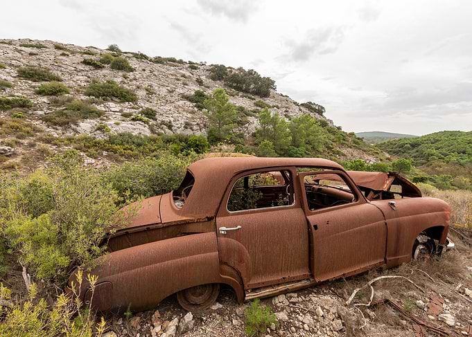 Abandoned Rusty Car in Nature