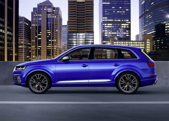 Blue Audi Q7 in Cityscape