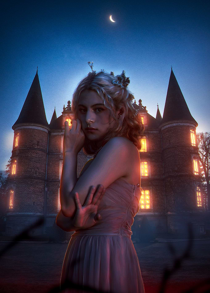 Woman in front of castle at night