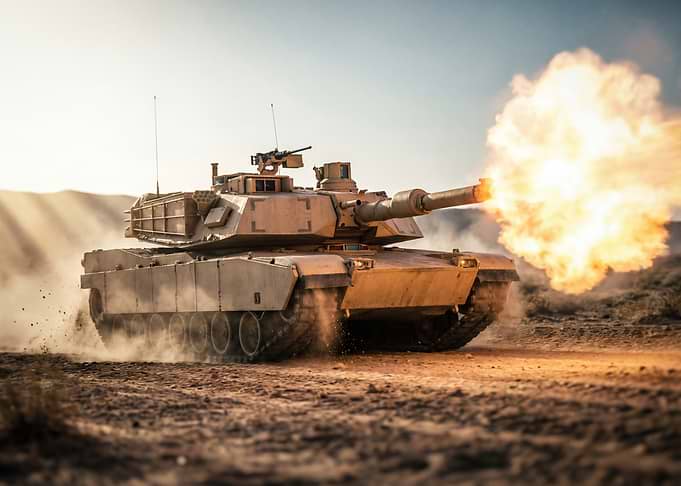 Tank firing in desert landscape