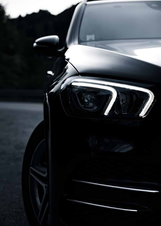 Sleek Black Car Headlight Detail