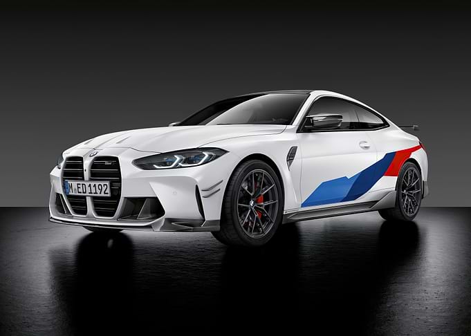 White BMW M4 with racing stripes