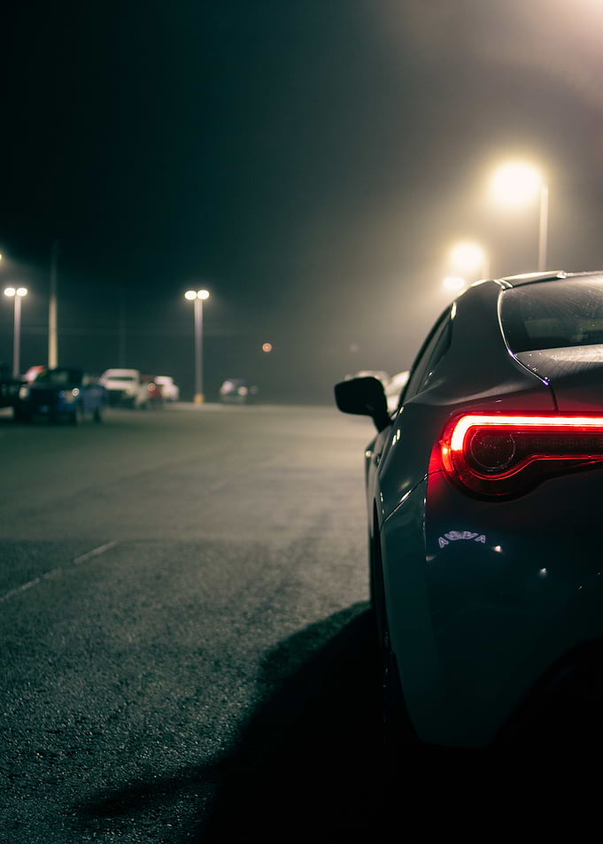 Car in Foggy Parking Lot