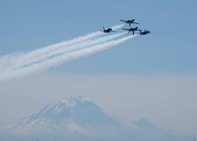 Blue Angels formation over mountain
