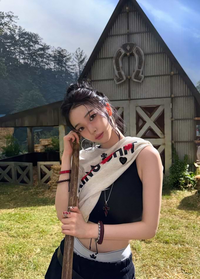 Young Woman with Staff in Rural Setting