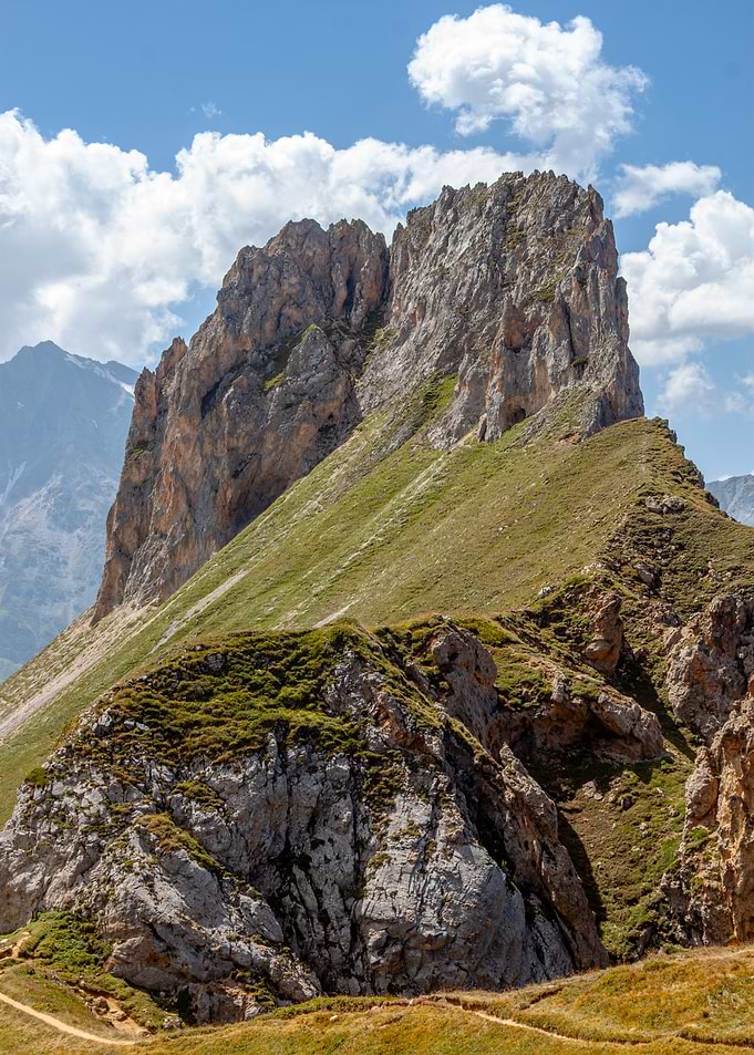 Mountain peak with green slopes