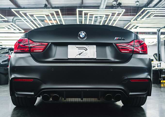 Matte Black BMW M4 Rear View