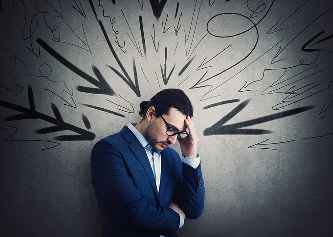 Stressed Man with Arrows Overhead