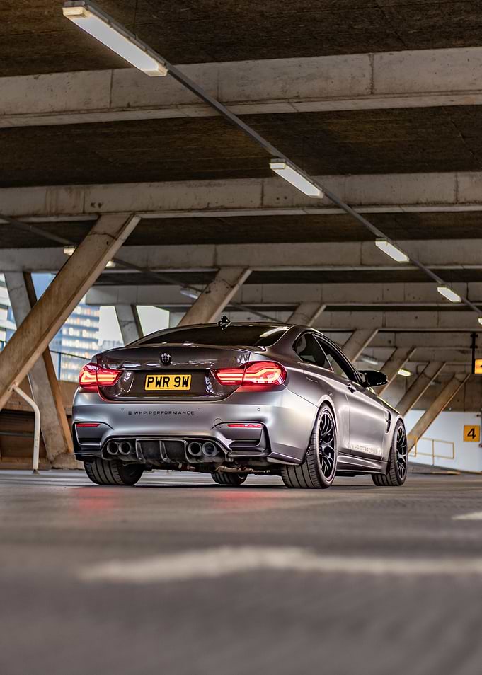 Silver BMW M4 in Parking Garage