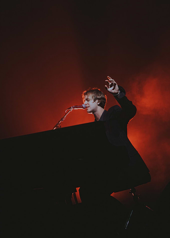 Singer at Piano in Red Light