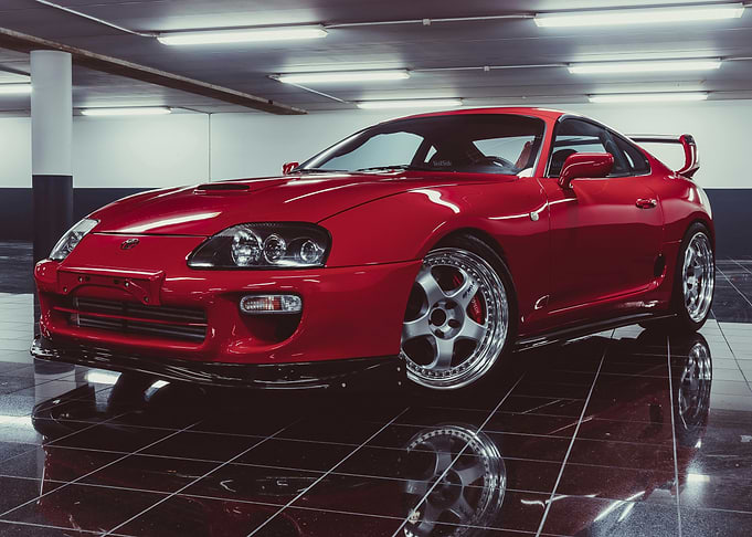 Red Toyota Supra in Garage