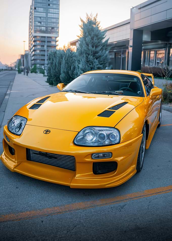 Yellow Toyota Supra parked outdoors