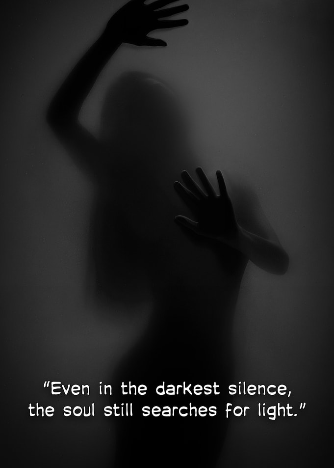 Silhouette reaching for light in darkness