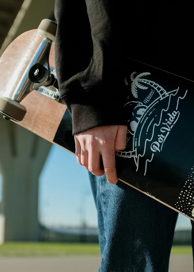 Skateboard with 'Por Vida' Design