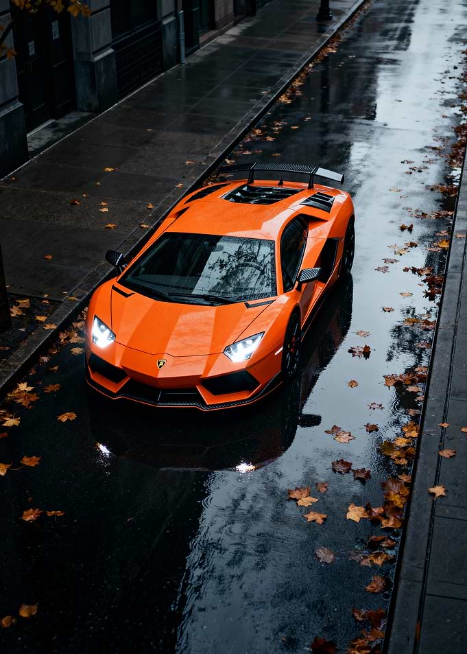 Orange Lamborghini Aventador on Wet Street