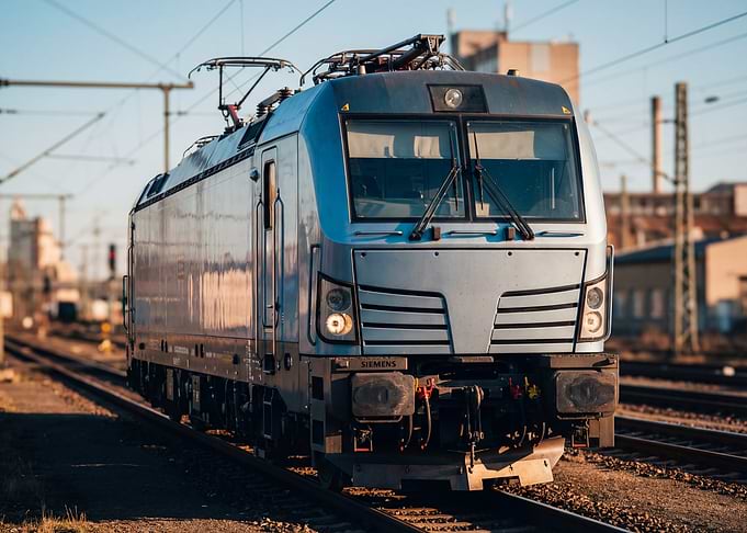Silver Electric Locomotive Train on Tracks