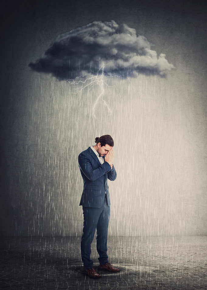 Man in Rainstorm with Dark Cloud