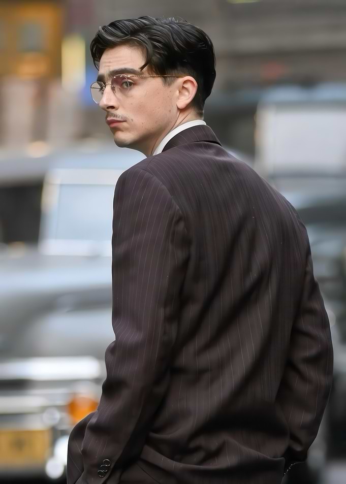 Man in Pinstripe Suit Looking Back