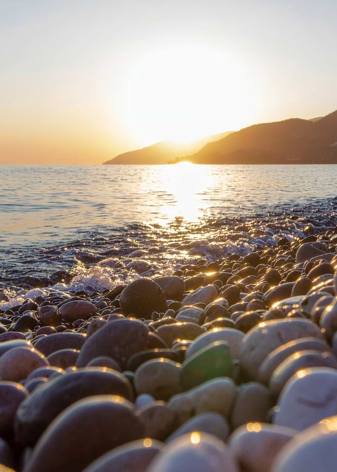 Sunset on a pebble beach