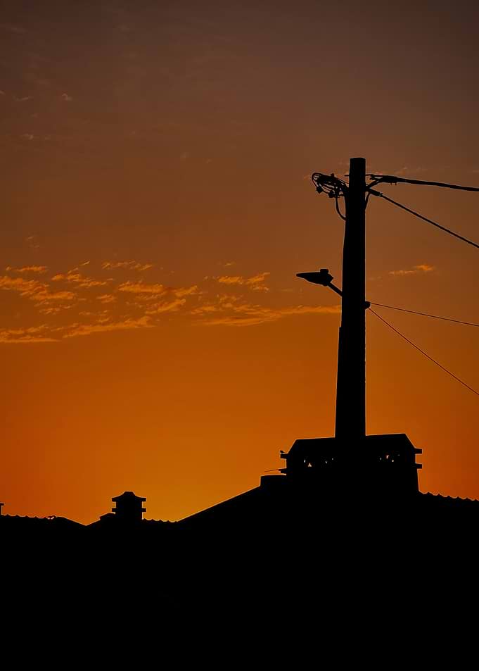 Silhouette of a building at sunset
