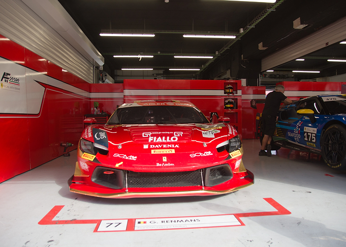 Red Ferrari Race Car in Garage