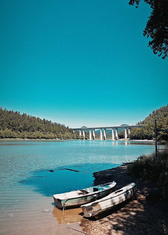 Lake with Boats and Bridge