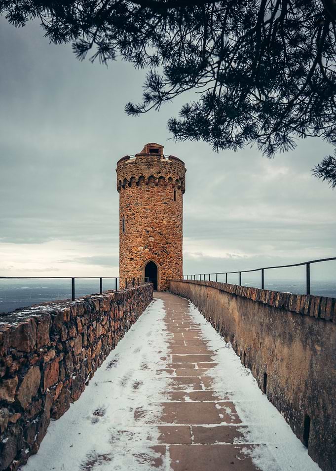 Stone Tower in Winter Landscape