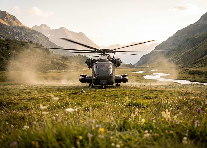 Military Helicopter in Mountainous Landscape