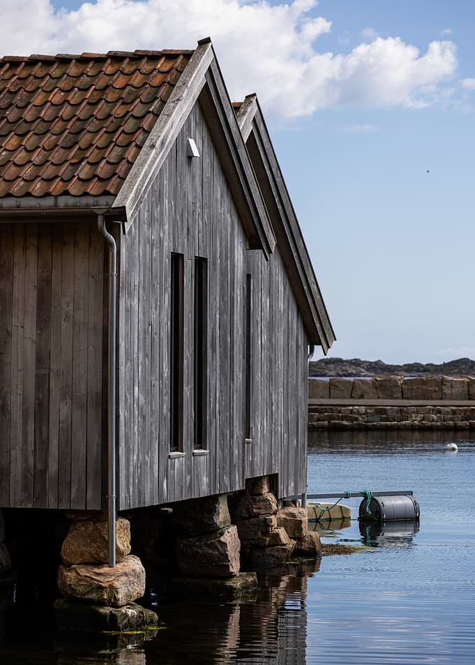 Wooden Boathouse on Water - Norway