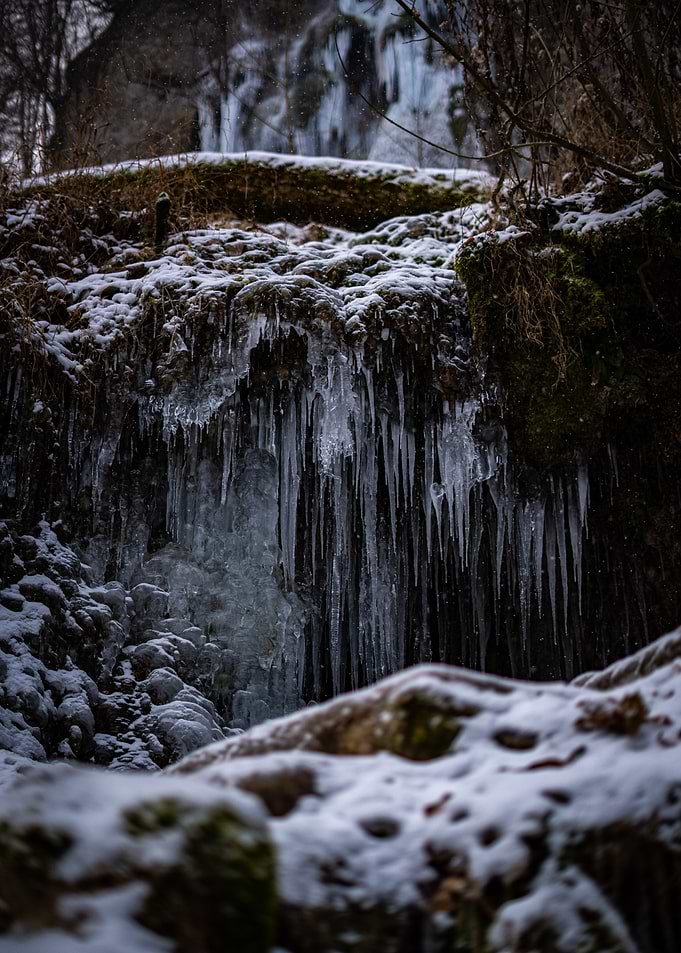Frozen Waterfall with Icicles and Snow