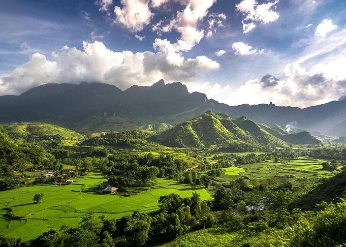 Lush Green Valley Landscape with Mountains