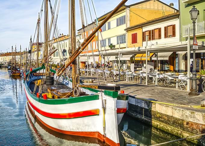 Colorful Boats Docked in Canal