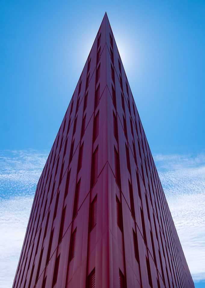 Modern Red Building Against Blue Sky