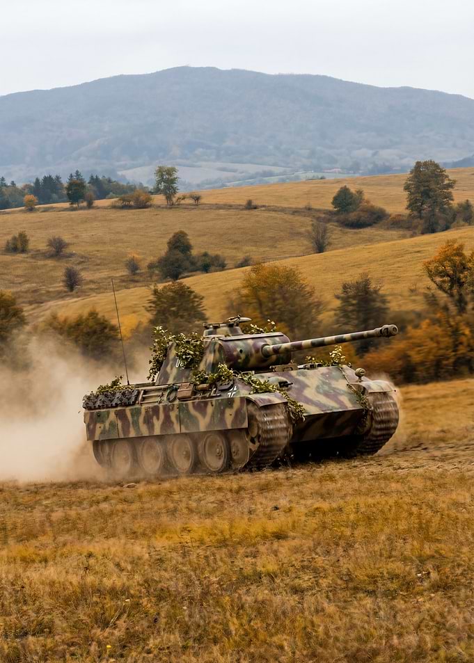 Camouflaged Tank in Field