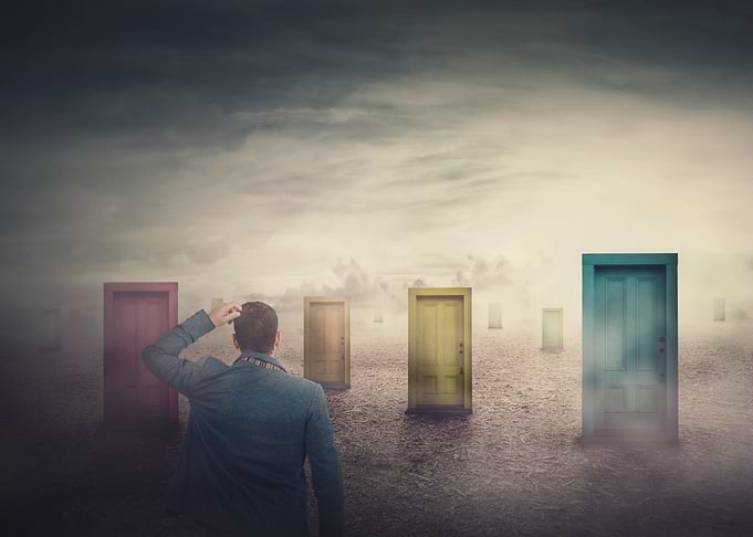 Man Choosing Between Many Doors