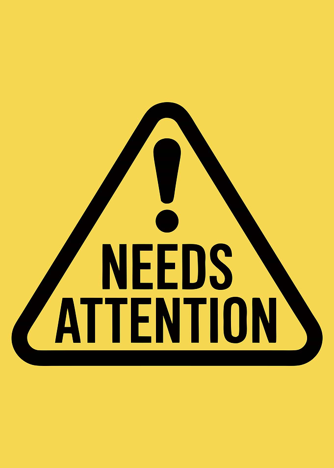Needs Attention Warning Sign