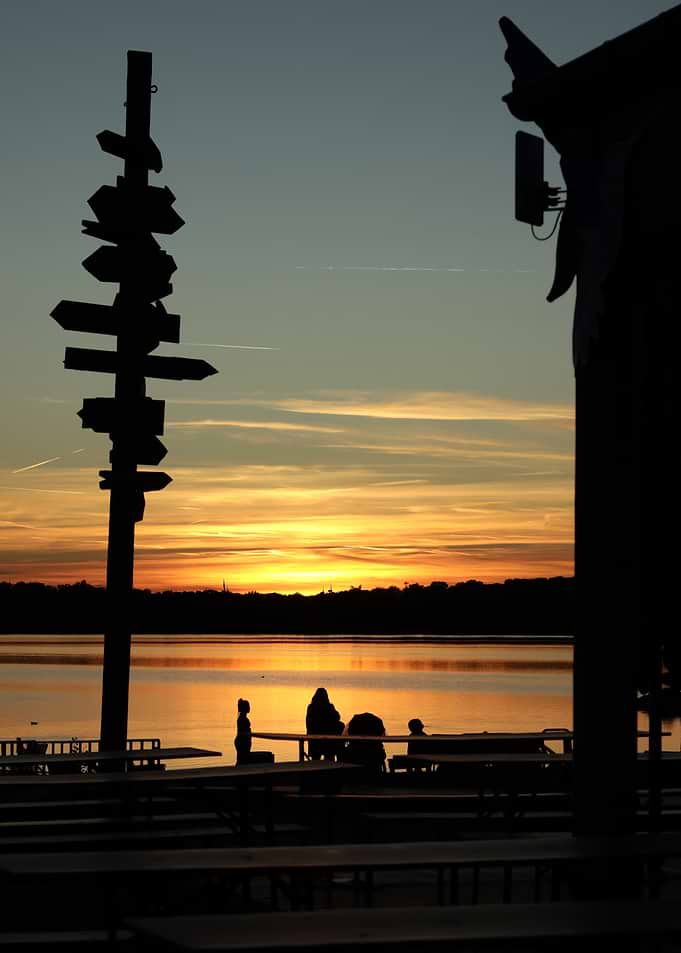 Sunset at the lake with silhouettes