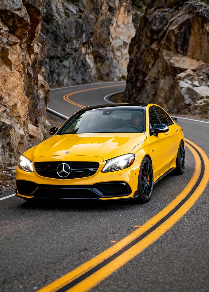 Yellow Mercedes-Benz on Mountain Road