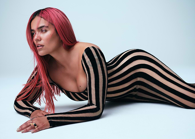 Karol G in Striped Bodysuit